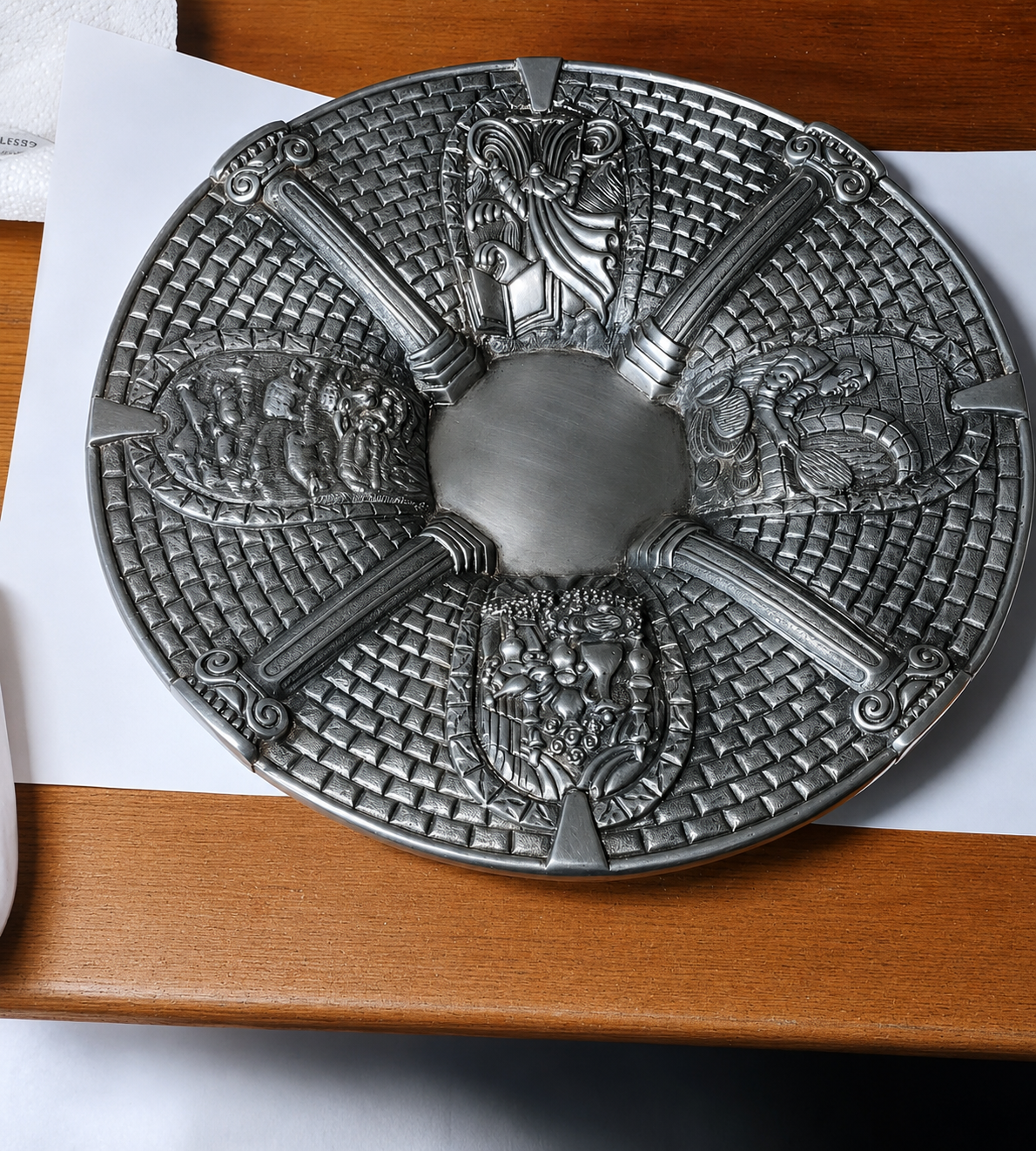 Museum-quality sterling silver Passover Kiddush cup and Seder plate set with dark patinated finish, narrative relief sculpture, classical architectural elements, grapevine ornamentation, and a luminous 24K gold vermeil cup interior.