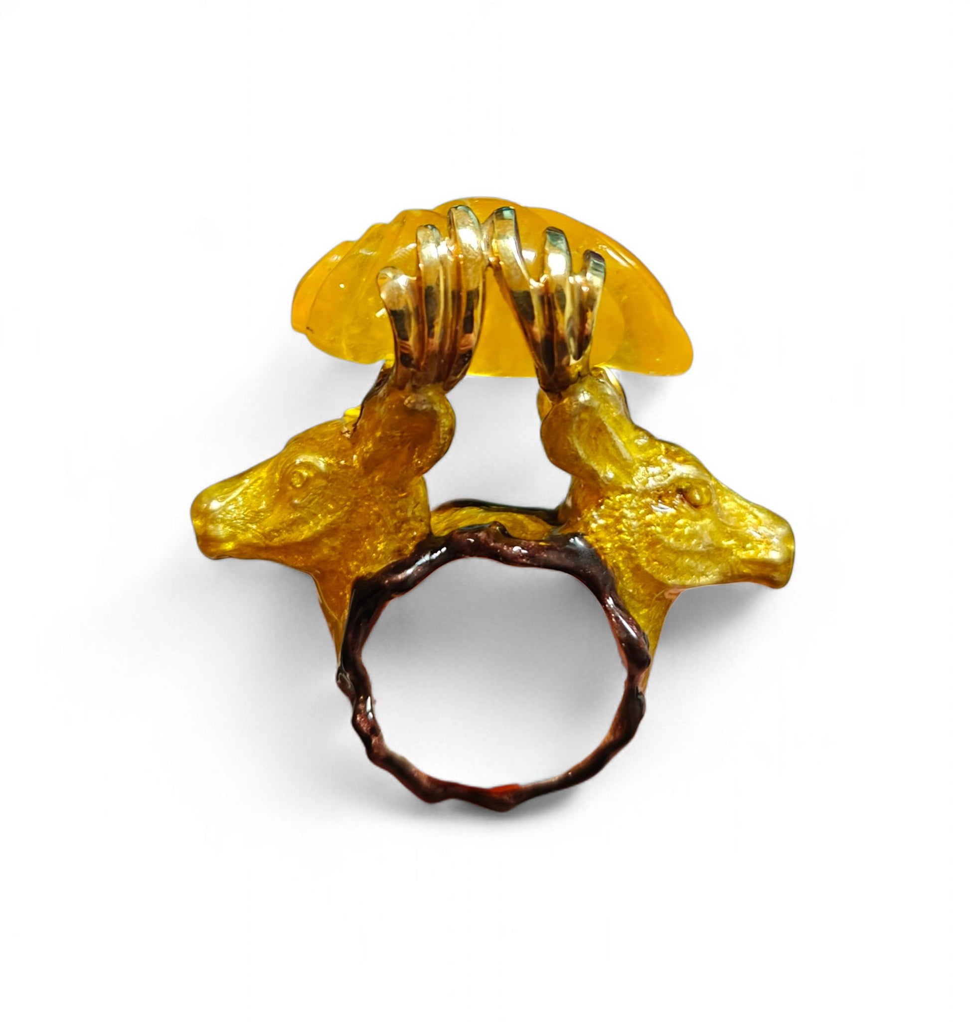Side view of the Guardians of the Sun ring by Konforti Jewelry from the Stone Garden Collection, showing the 960 silver craftsmanship, sculpted stag figures supporting a 90 ct yellow lepidolite gemstone, and vivid hot enamel artistry around the base.