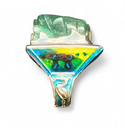 Side view of the Landscape in Flight ring by Konforti Jewelry from the Stone Garden Collection, showcasing the monumental 121 ct hand-carved aquamarine centerpiece framed by 960 silver craftsmanship and layered Limoges enamel paintings that create a sense of depth and movement.