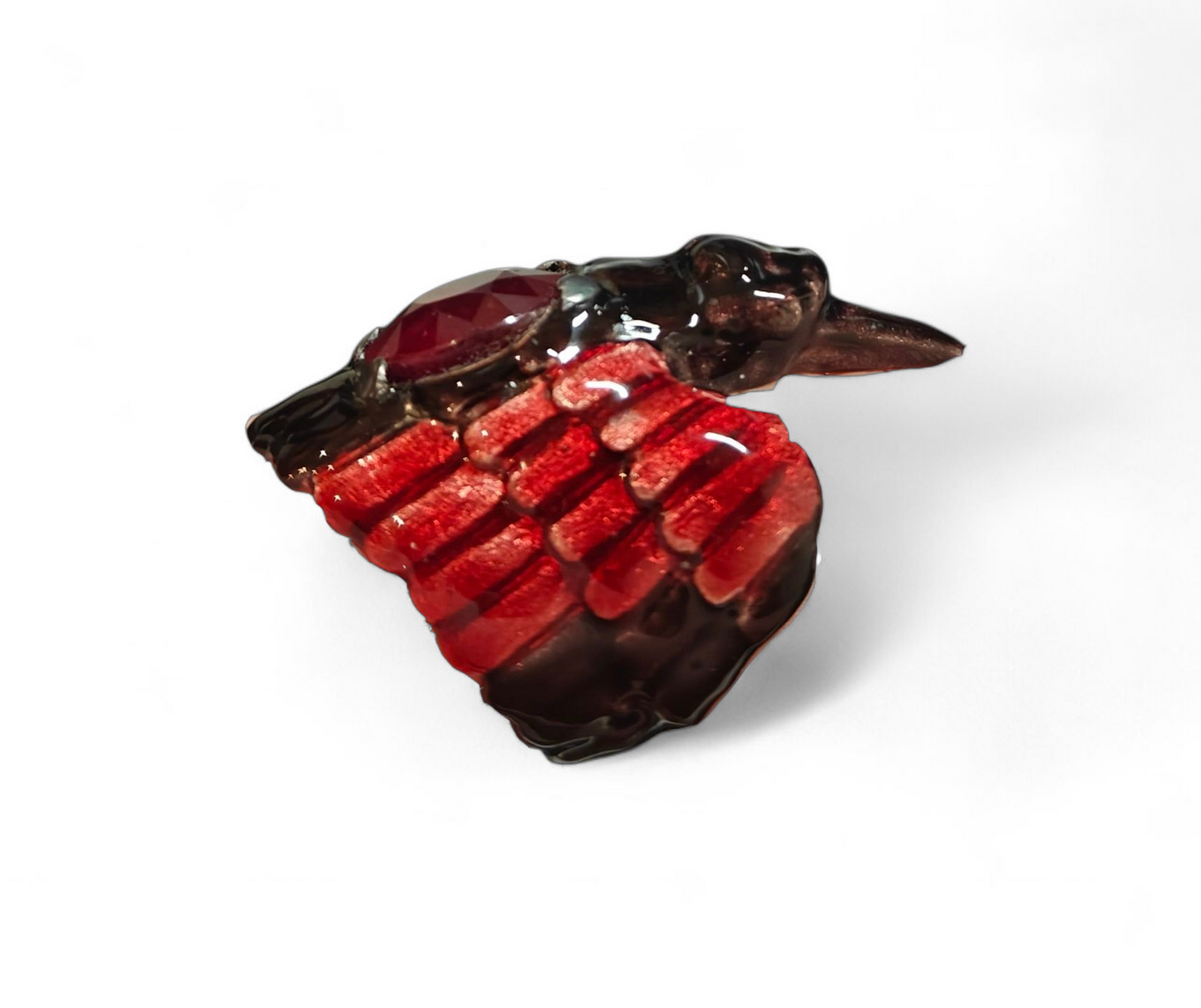 Side view of the Royal Raven ring by Konforti Jewelry from the Stone Garden Collection, highlighting the sculptural 960 silver structure, Limoges-style enamel artistry, and luxurious 24K gold plating that frame the 8.45 ct treated ruby in a powerful, regal composition.