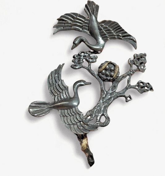 Front view of the Song of the Nest set from the Stone Garden Collection by Konforti Jewelry, featuring a handcrafted ring and bracelet in 960 silver with 24K gold-plated accents and artistic silver tarnishing that evoke the warmth and protection of a hidden nest.
