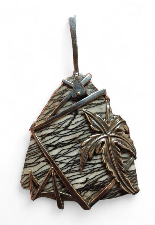 Front view of the Weaver of Dreams pendant from the Stone Garden Collection by Konforti Jewelry, handcrafted in 925 silver and centered with a 51.3 ct landscape jasper. The artistic silver tarnish enhances the natural stone patterns, creating a timeless and imaginative design.