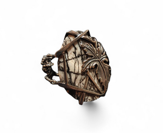 Front view of the Weaver of Dreams ring from the Stone Garden Collection by Konforti Jewelry, handcrafted in 925 silver and centered with a 51.3 ct hand-carved landscape jasper. The design reveals natural stone patterns enhanced with artistic silver tarnishing that evoke timeless imagination and artistry.