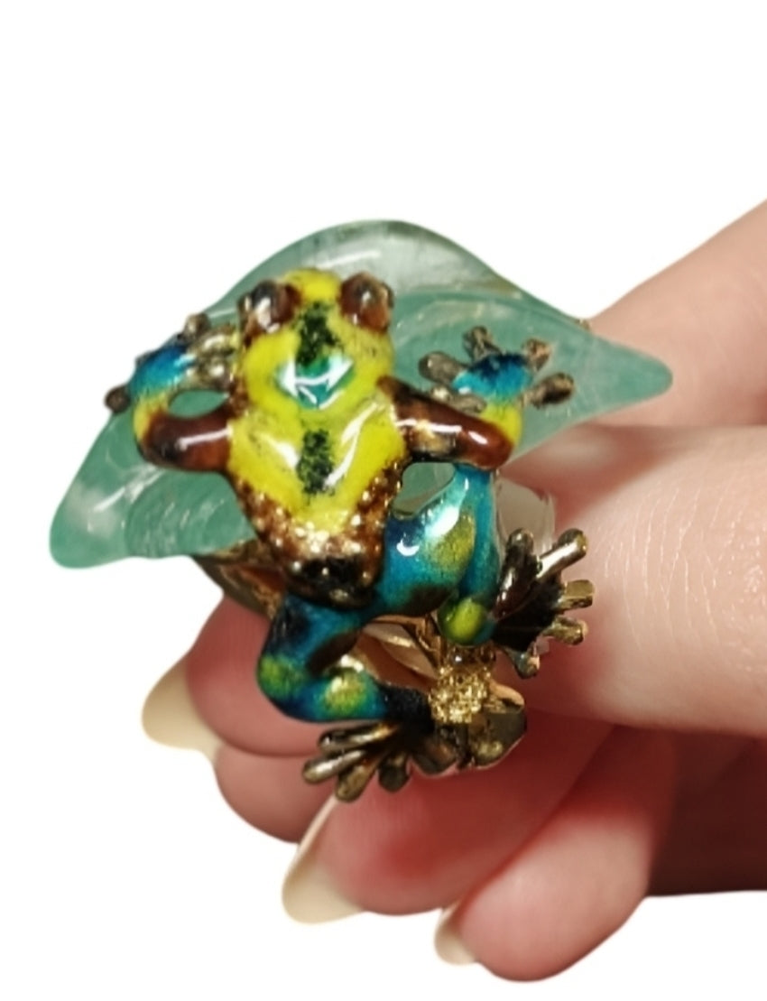 Close-up of hand-carved aquamarine and vibrant hot enamel artwork on the Summer Pond ring by Konforti Jewelry