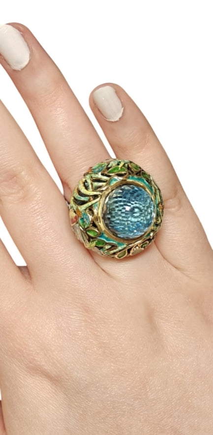 Close-up of blue topaz gemstone set in 18K gold with detailed enamel painting, handcrafted luxury ring by Konforti Jewelry