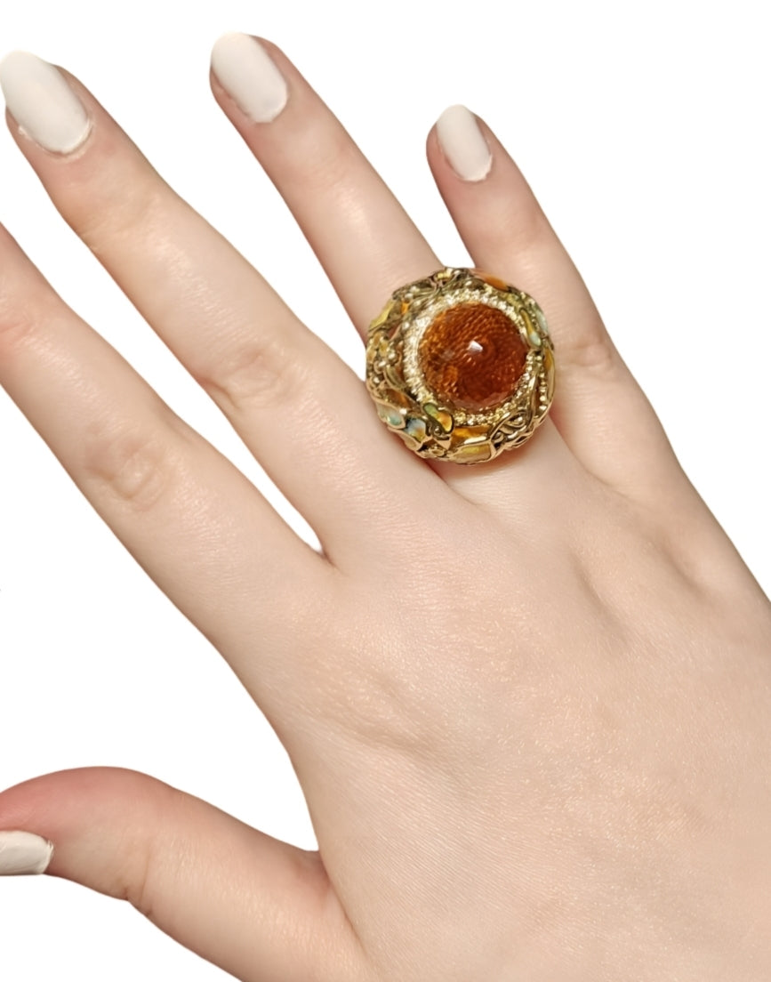 Autumn ring worn on hand, featuring 18K yellow gold, pear-shaped citrine madeira, yellow sapphires, and hot enamel by Konforti Jewelry