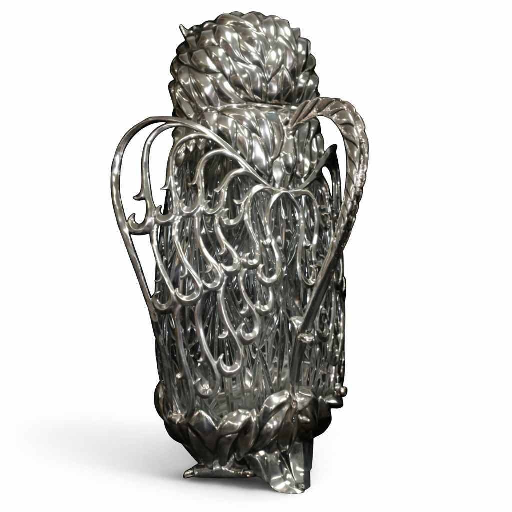 Back view of Guardian Owl wine pitcher showcasing sculpted sterling silver plumage and crystal feather carving