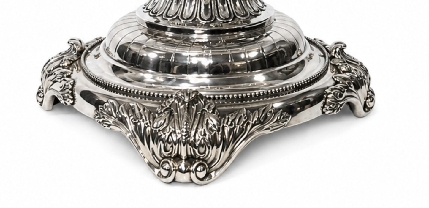 Handcrafted sterling silver foot detail displaying elaborate scrolling ornamentation on a luxury Fabergé-inspired crystal centerpiece.