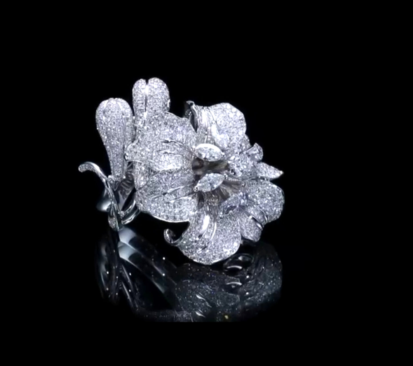 Profile view of high jewelry diamond flower ring in 18K white gold with layered pavé petals and sculptural setting