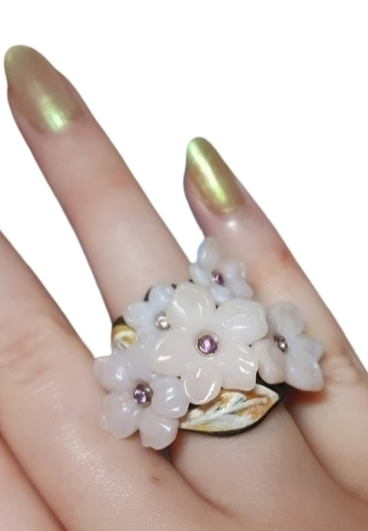 Pink Blossom ring from the Stone Garden Collection, made with 14K gold inner base and 18K yellow and white gold, featuring hand-carved pink opal flowers and pink sapphires by Konforti Jewelry