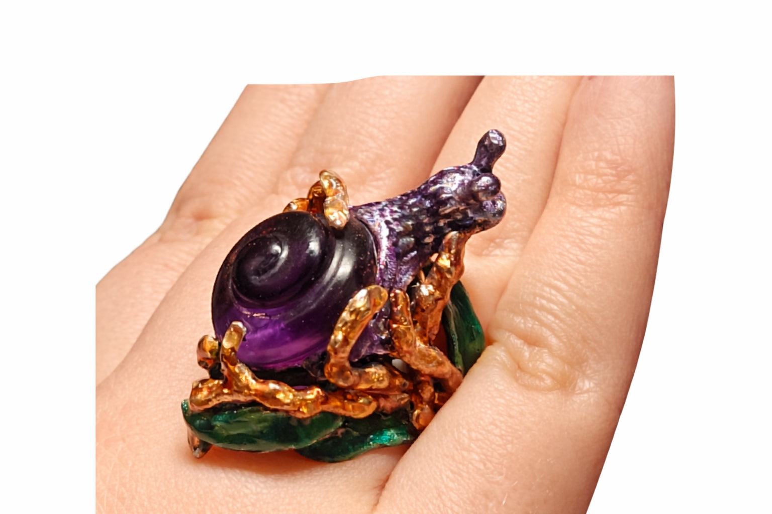 Handcrafted Amethyst Wanderer snail ring with 29ct hand carved amethyst shell in 960 silver and hand painted enamel from the Stone Garden Collection by Konforti Jewelry shown on hand
