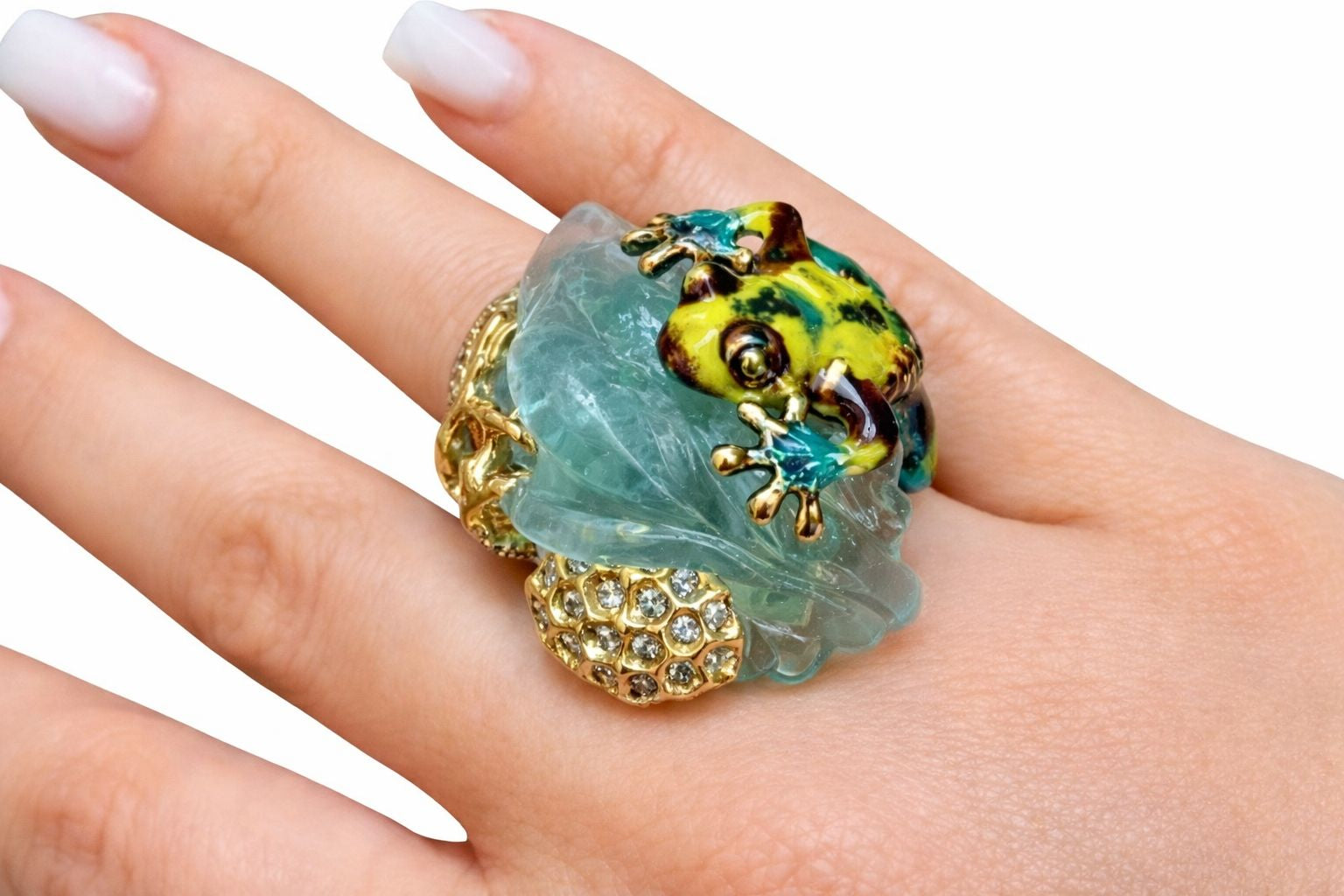 Handcrafted 18K gold frog ring with carved aquamarine shown worn on hand for scale