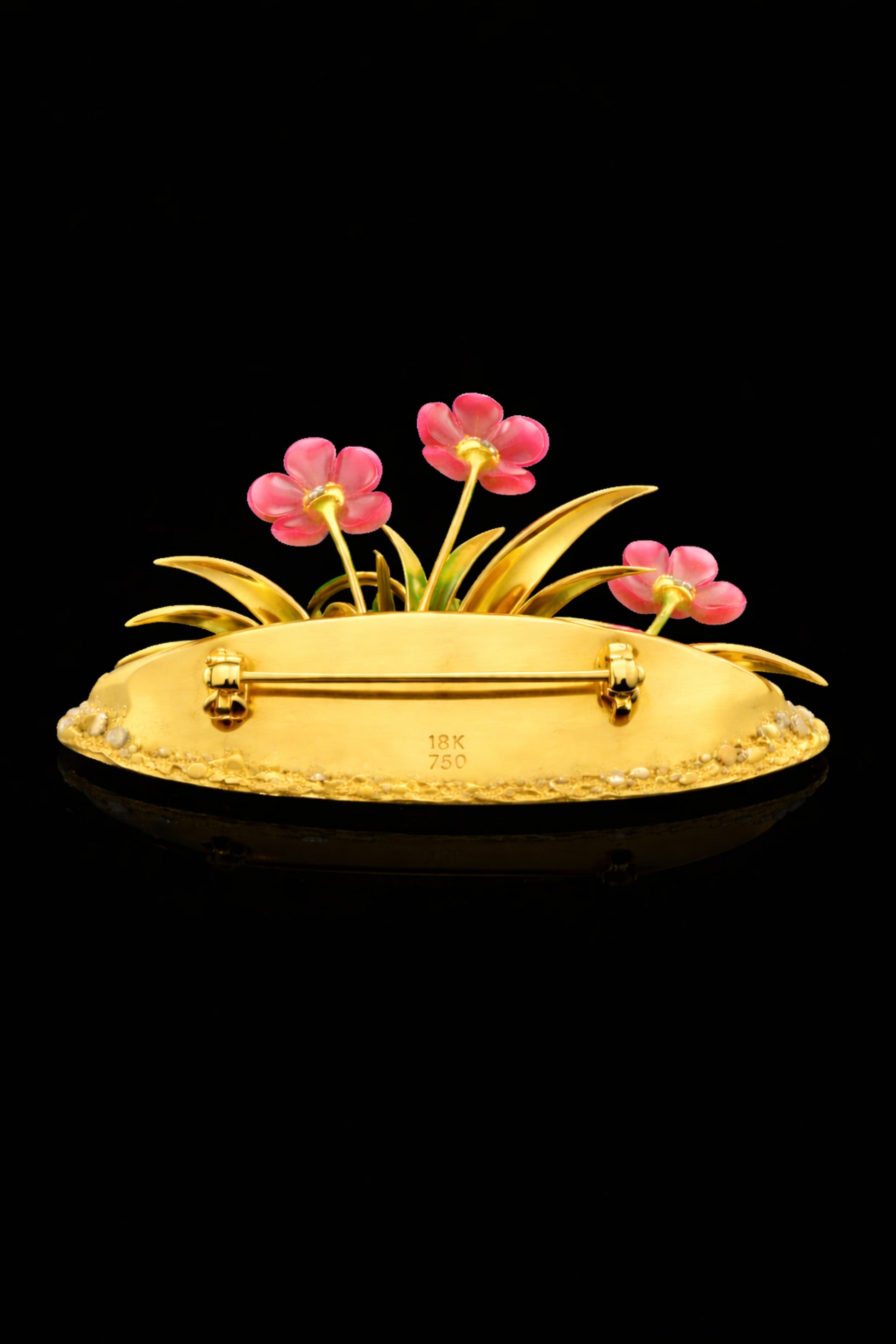 Back view of the Blooming Harmony 18K gold floral brooch showing the handcrafted gold structure, hallmarks, and secure pin mechanism.
