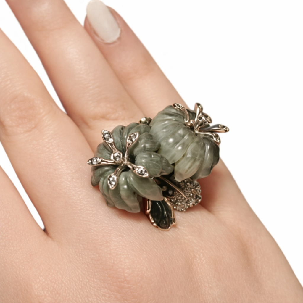 Top view of the Asian Lilly ring worn on hand, featuring hand-carved cat’s eye gemstone flowers set in 18K white gold