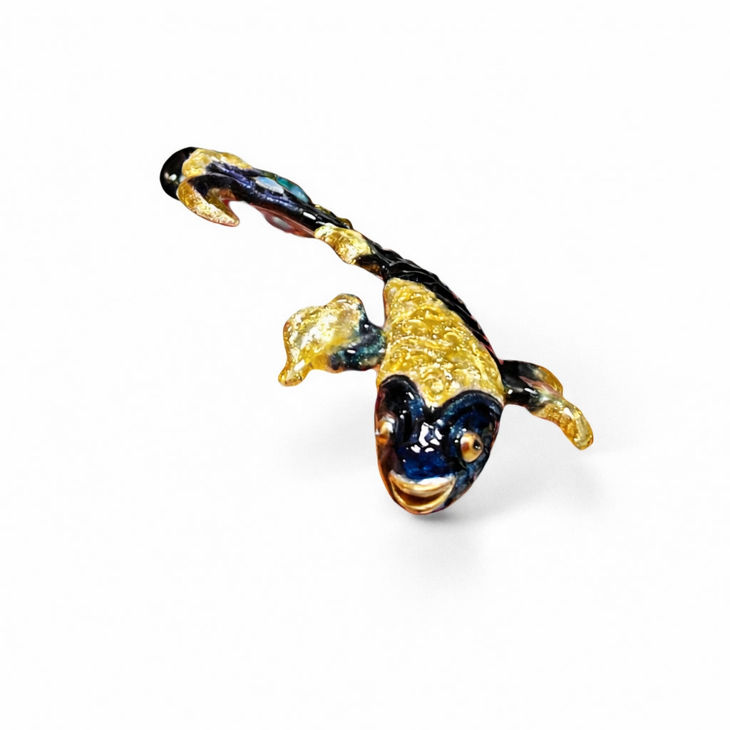 Sculptural betta fish art pendant showing dimensional form and textured enamel with blue topaz centerpiece and opal accents in handcrafted silver jewelry.