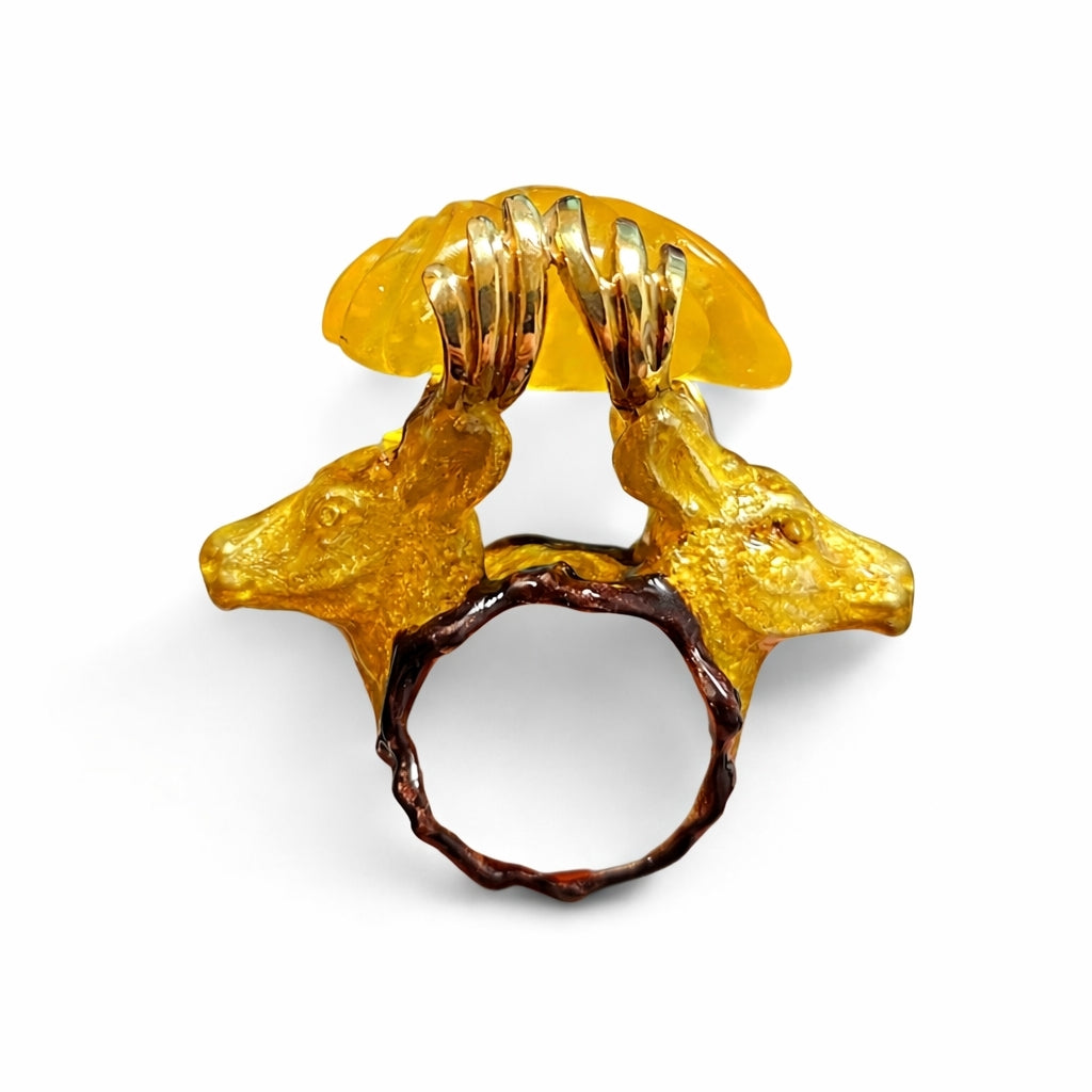 Side view of handcrafted Konforti Jewelry stag head ring with luminous yellow lepidolite gemstone and hot enamel detailing in 960 silver