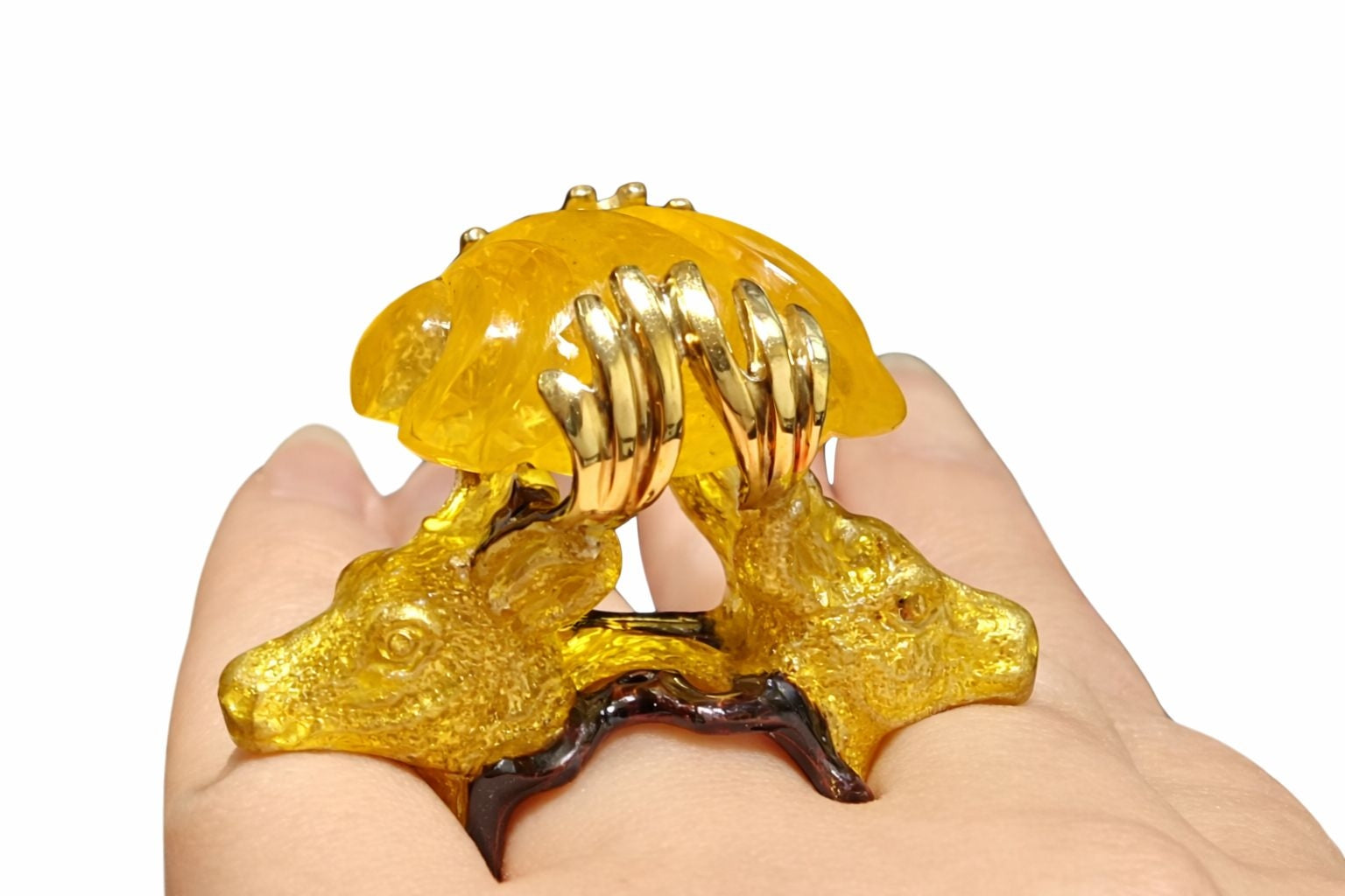 Guardians Of The Sun statement ring with glowing yellow lepidolite gemstone and sculpted stag heads in 960 silver worn on hand by Konforti Jewelry