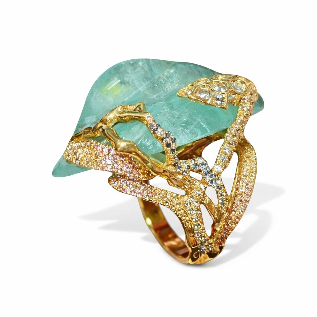 Side profile of an 18K gold frog ring revealing the architectural openwork setting