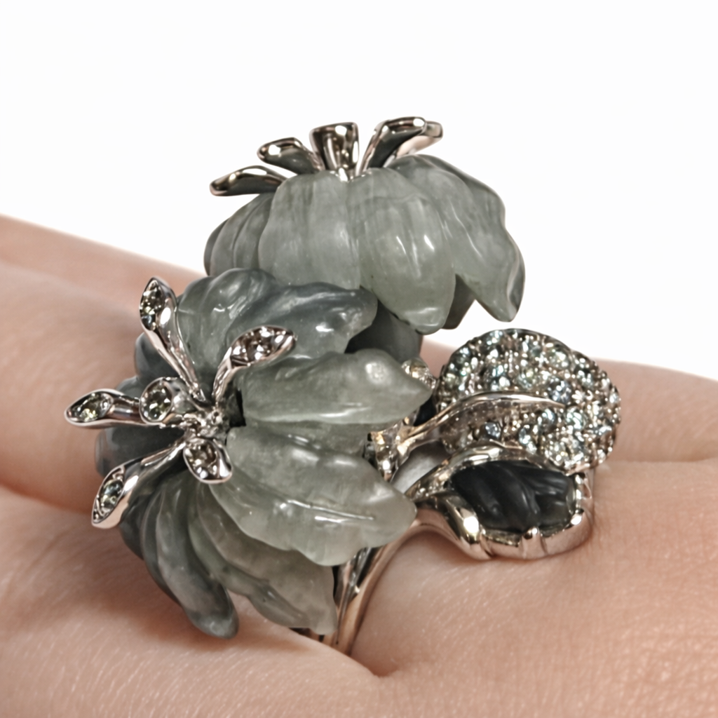 Close-up of hand-carved cat’s eye stone flowers with grey sapphire accents in the Asian Lilly ring
