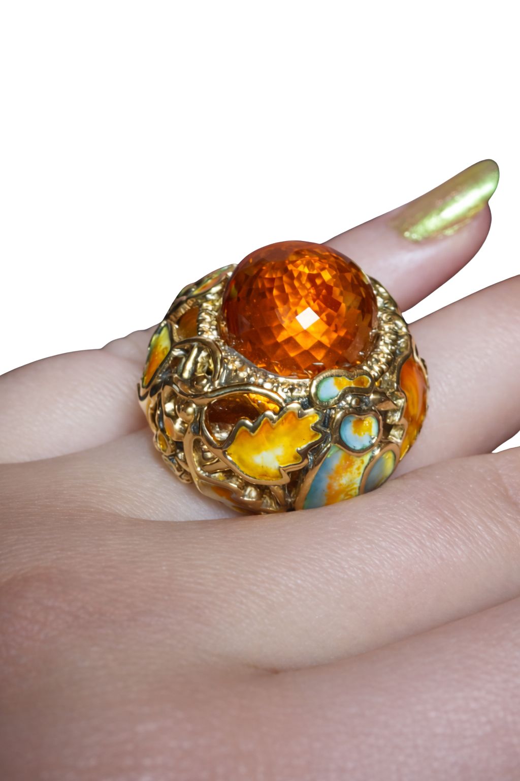 Close-up detail of the Autumn ring highlighting hand-painted hot enamel and yellow sapphire accents beneath the Madeira citrine