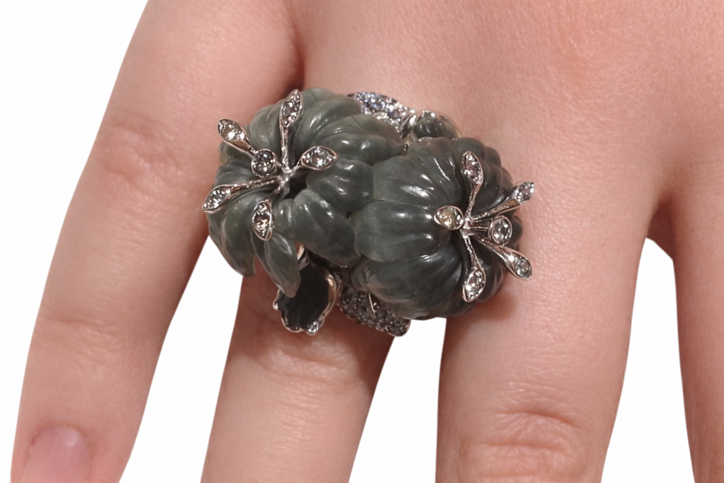 Side profile of the Asian Lilly ring revealing the sculptural 18K white gold setting and carved cat’s eye gemstones