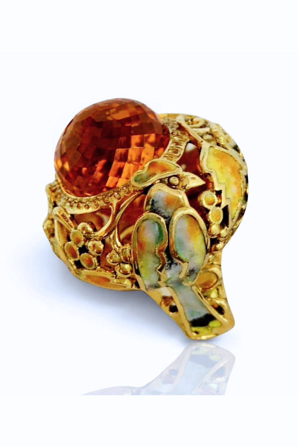 Angled view of the Autumn ring with faceted pear-shaped Madeira citrine, artisan goldwork, and warm autumn-inspired enamel tones