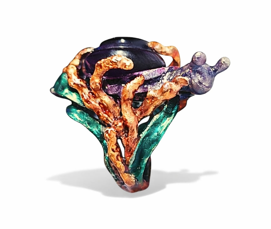 Collector art jewelry ring featuring sculptural snail with carved 29ct amethyst shell and layered enamel in 960 silver from Stone Garden Collection by Konforti Jewelry