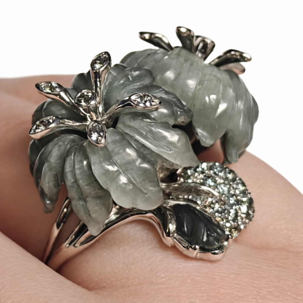 Detail of grey sapphire accents set among hand-carved cat’s eye gemstones in the Asian Lilly ring