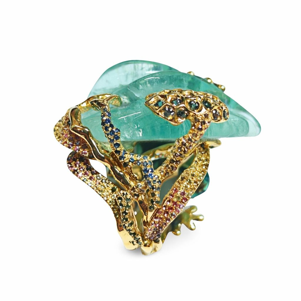 Close-up of pavé-set diamonds embedded in the 18K gold setting of the frog ring