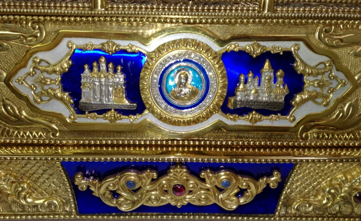 Close-up of the chessboard side panel showing transparent hot enamel over guilloché, silver relief motifs, and imperial decorative detailing.