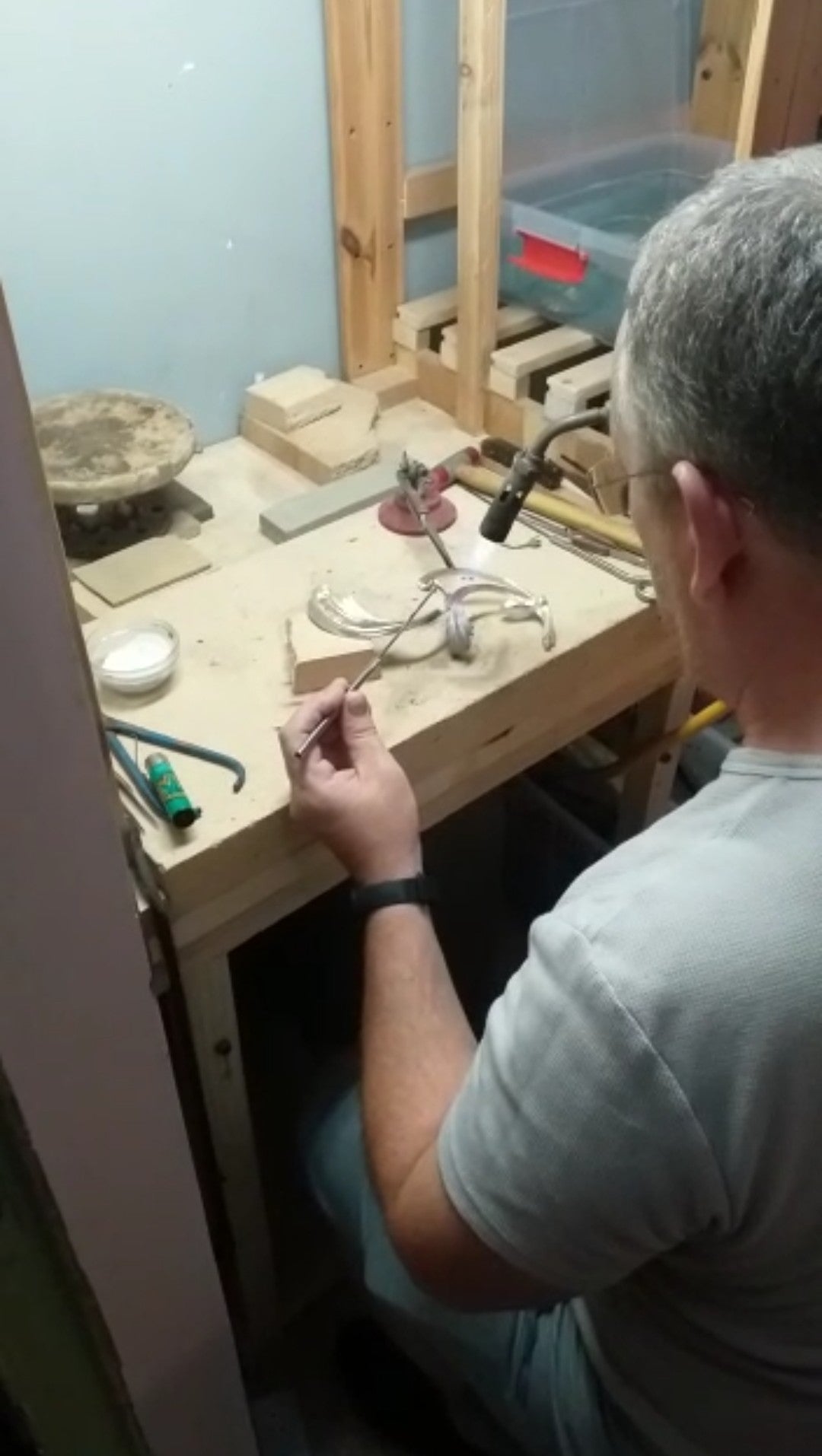Master silversmith handcrafting a sterling silver sculpture at the Konforti family atelier