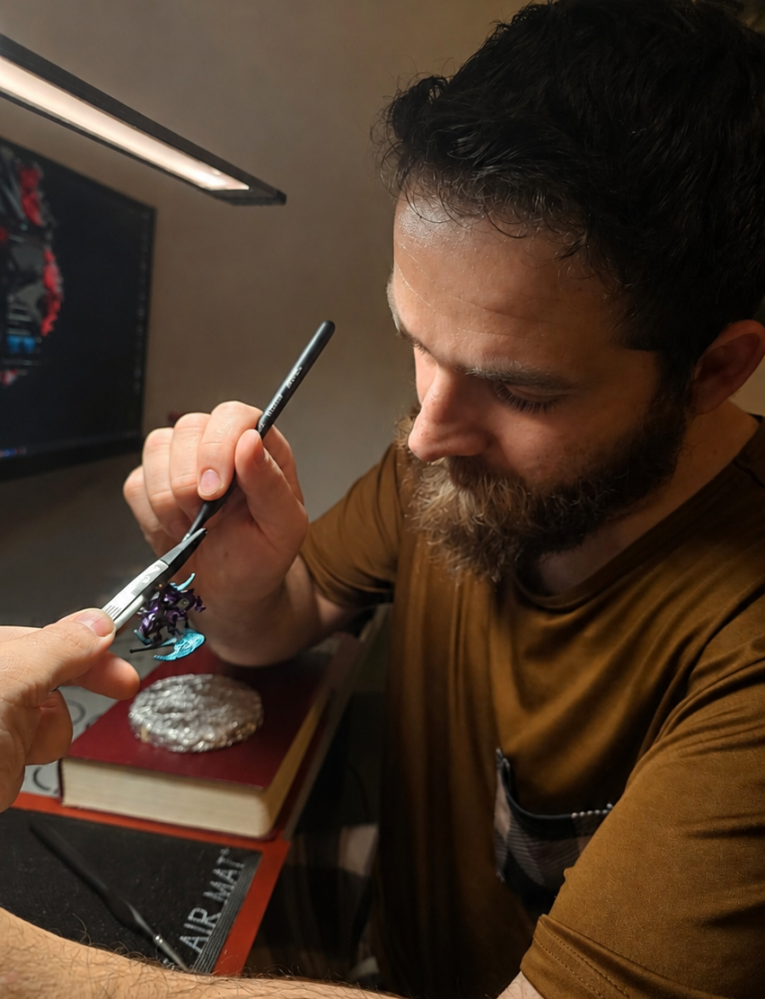 Konforti atelier artisan hand-finishing a sculptural jewelry piece using traditional craftsmanship