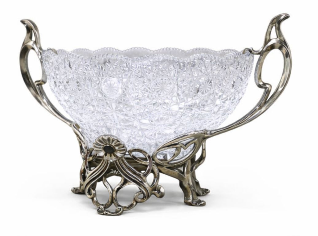 Side view of an Art Nouveau crystal centerpiece bowl with sculptural sterling silver handles