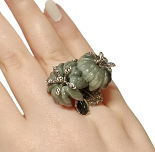 On-hand view of the Asian Lilly ring in 18K white gold, showing the hand-carved cat’s eye stone flowers and 3ct grey sapphires from the Stone Garden Collection.