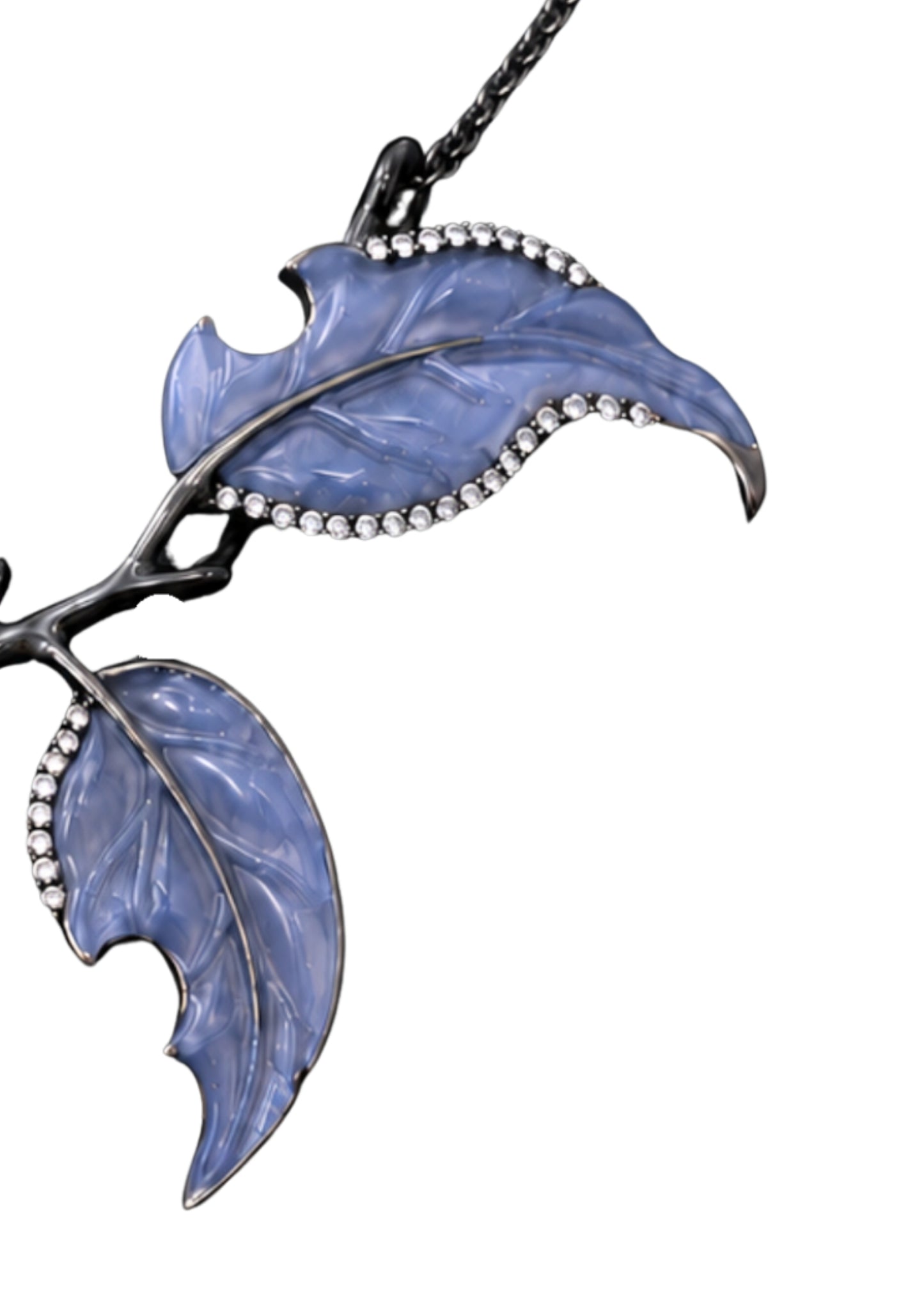 Detailed view of hand-carved angelite leaves framed by pavé-set diamonds on the Golden Persimmon 18K gold pendant.