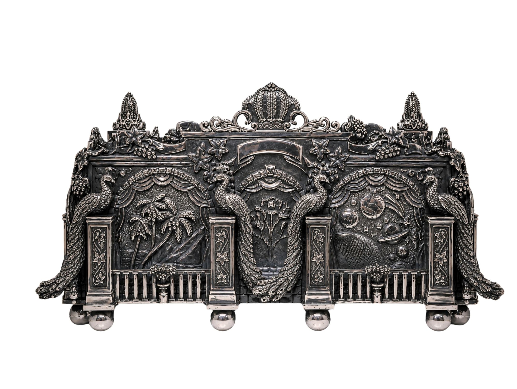 Handcrafted Eden Palace sterling silver napkin holder by Konforti featuring peacock sculptures, palace arches, grapevine ornamentation, Genesis-themed relief panels, and tarnished 925 sterling silver architectural detailing.