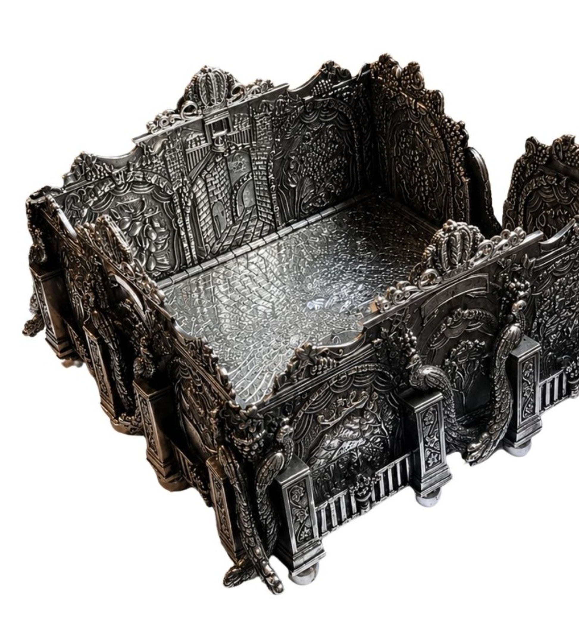 Sterling silver Eden Palace napkin holder interior showing engraved peacock floor panel, grapevine scrollwork, biblical relief windows, and richly detailed architectural silversmithing in oxidized silver.