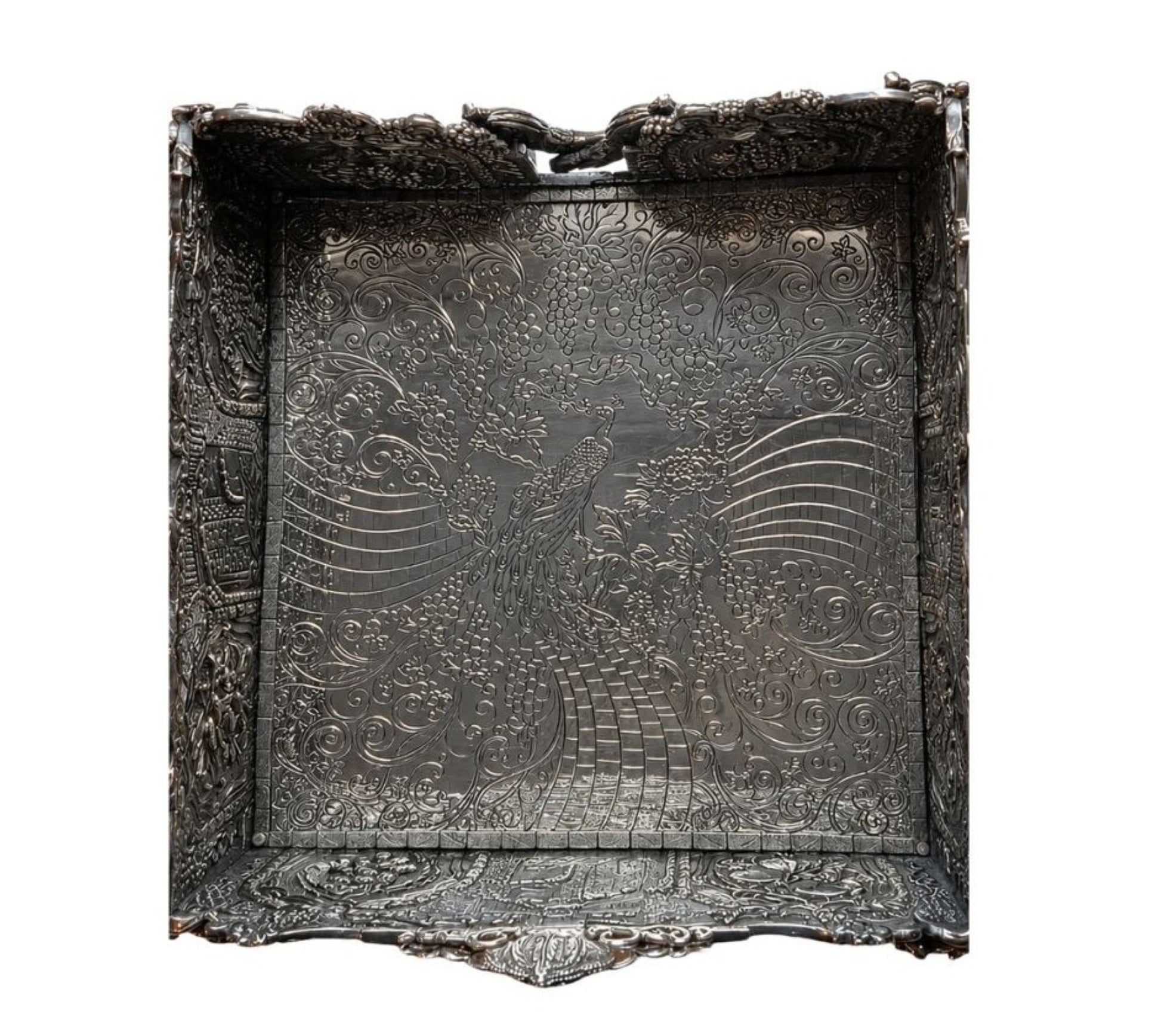 Engraved peacock composition inside Eden Palace sterling silver napkin holder surrounded by flowing Art Nouveau grapevine ornamentation and intricate hand-chased silver detailing.
