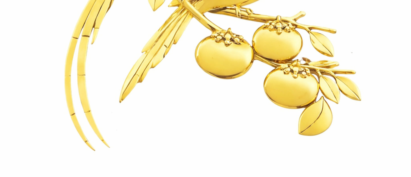 Close-up of elongated enamel songbird tails showcasing intricate hot enamel artistry and 18K gold framework in the Persimmon Garden brooch.