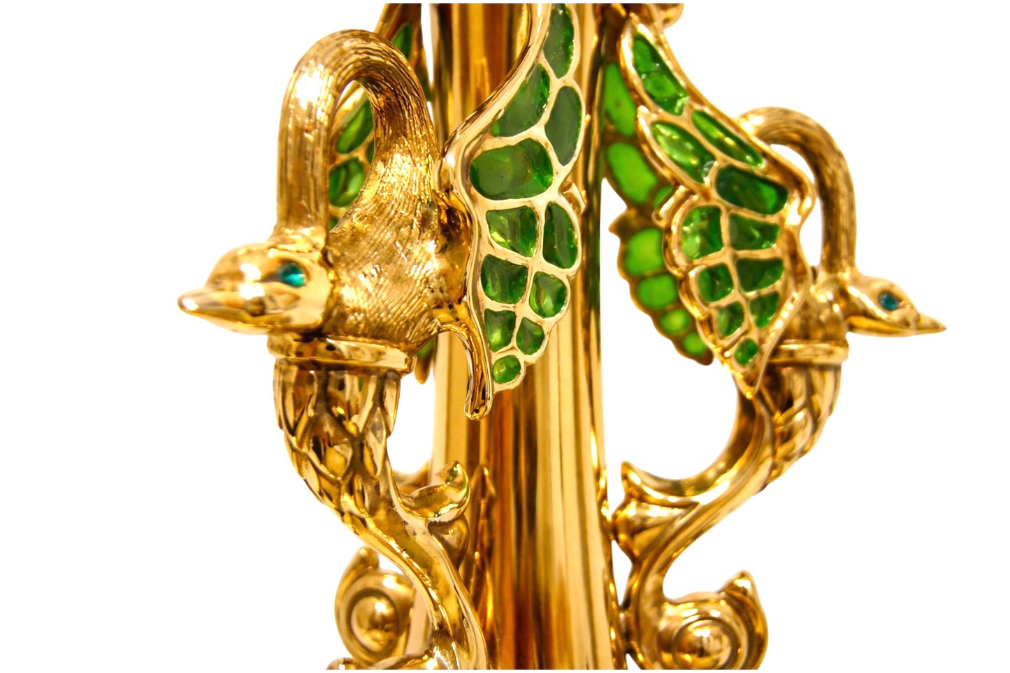 Close-up of gold-plated bird handles with green enamel wings on luxury sterling silver centerpiece