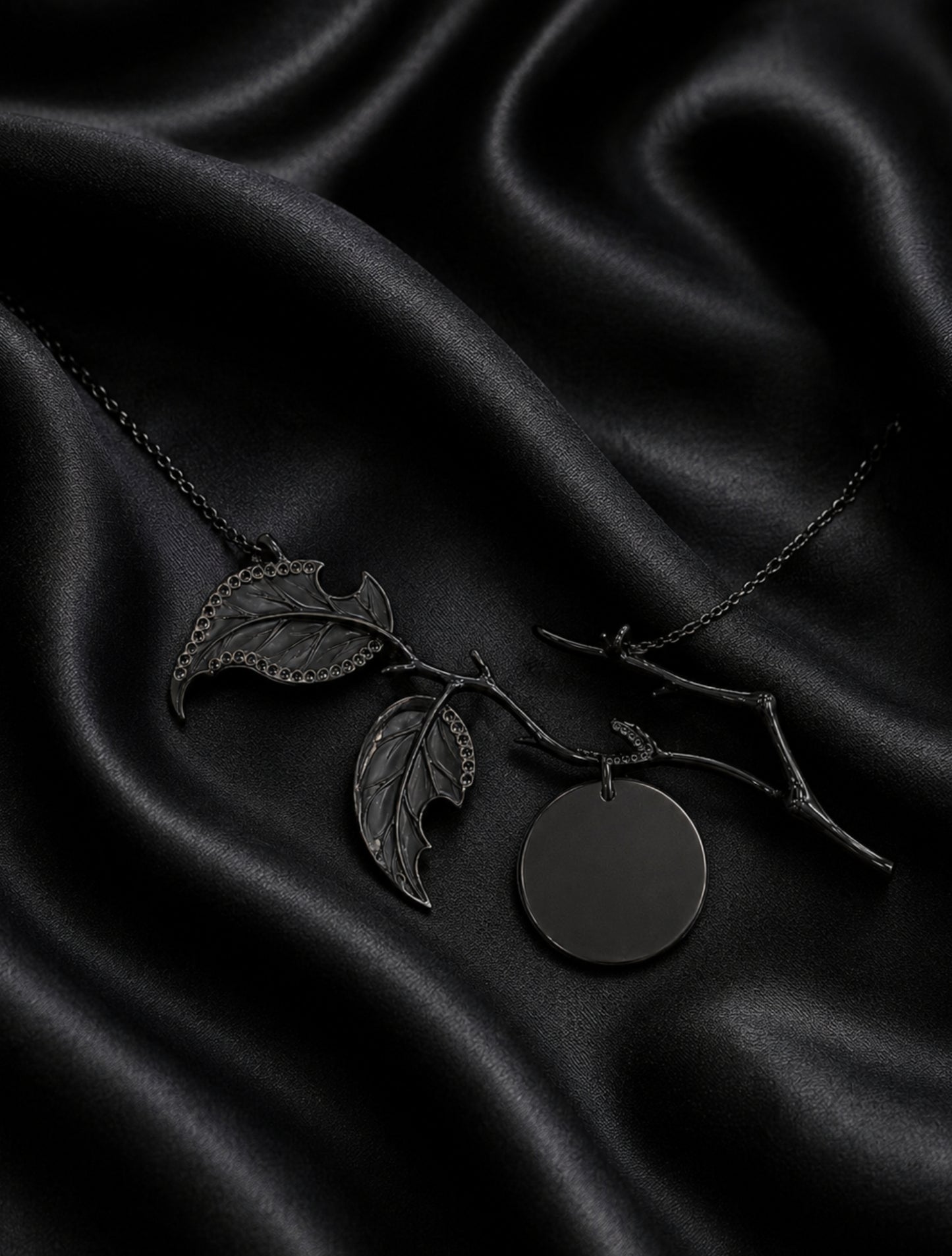 Reverse view of the Golden Persimmon pendant showing black rhodium-coated 18K gold construction, angelite leaf backs, and diamond setting craftsmanship.