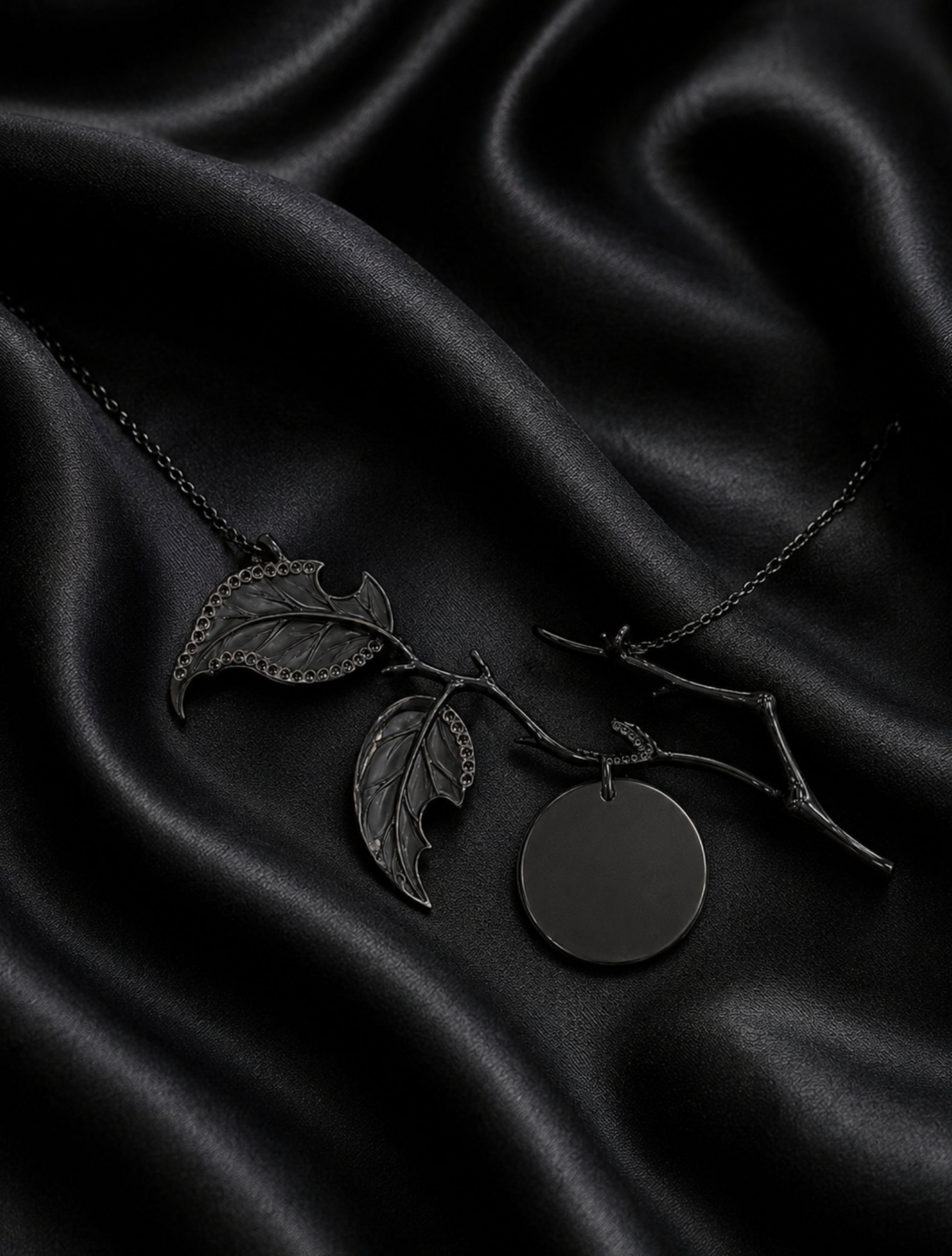 Reverse view of the Golden Persimmon pendant showing black rhodium-coated 18K gold construction, angelite leaf backs, and diamond setting craftsmanship.