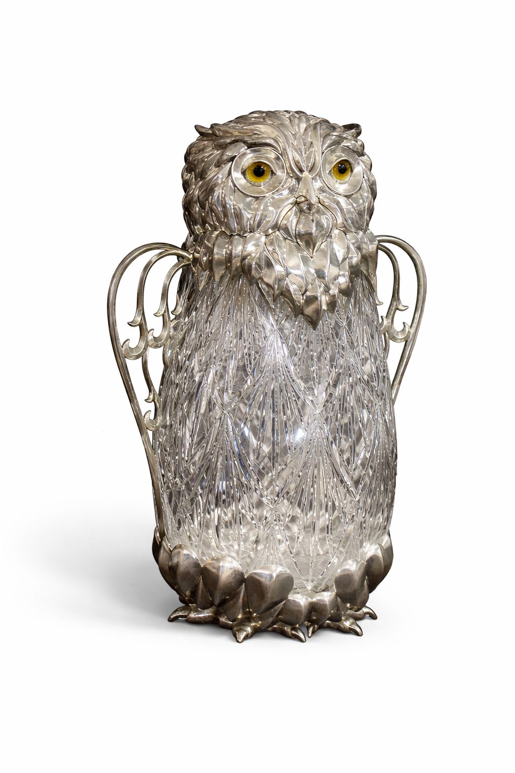 Side view of Guardian Owl wine pitcher highlighting ornate silver feather handles and crystal carved body