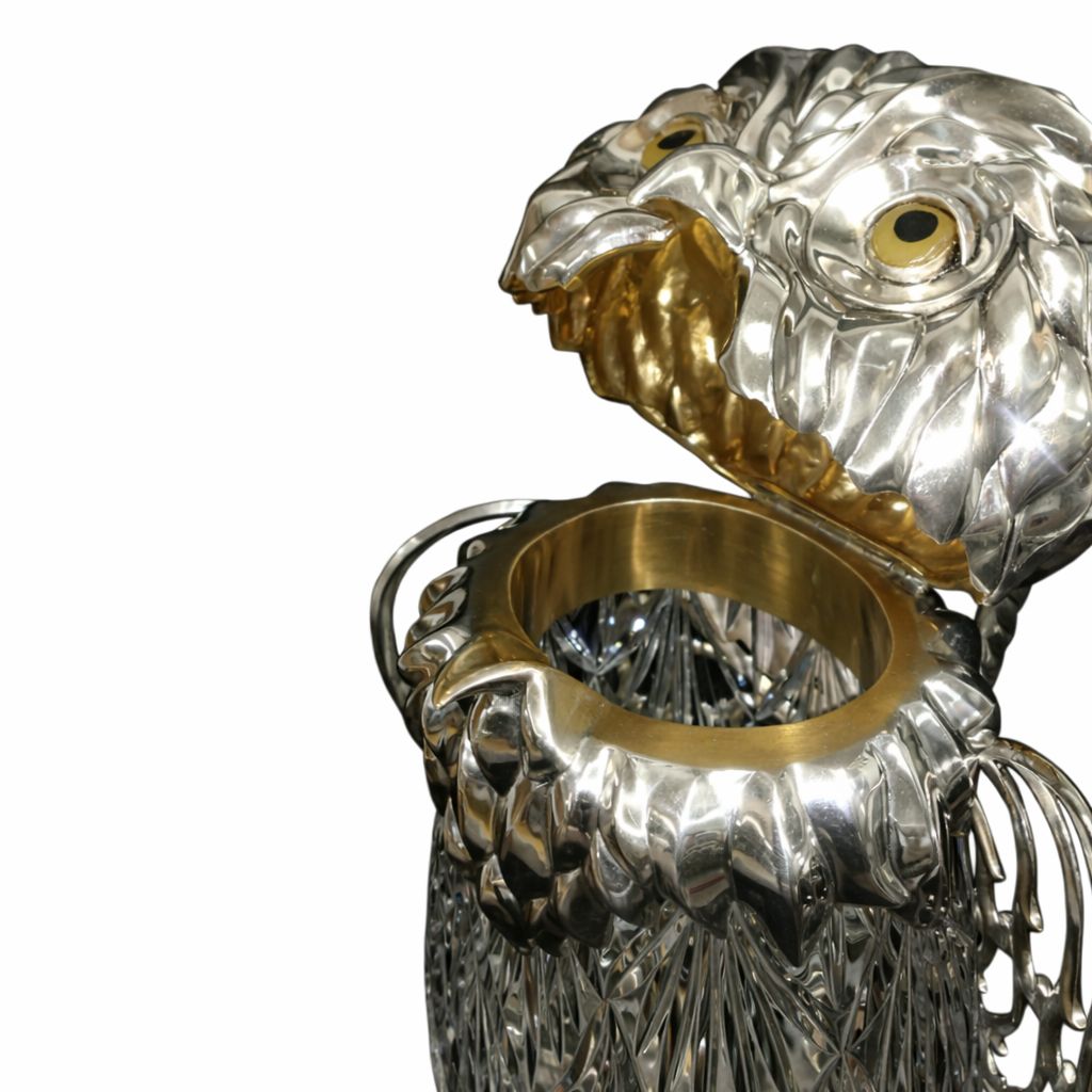 Close-up of Guardian Owl wine pitcher showing gilded 24k gold interior and sculpted sterling silver head