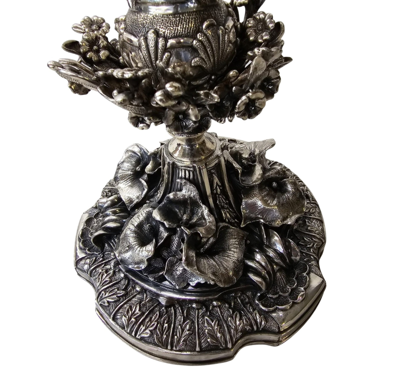 Sterling silver candelabra base detail with floral relief and sculptural ornamentation luxury centerpiece