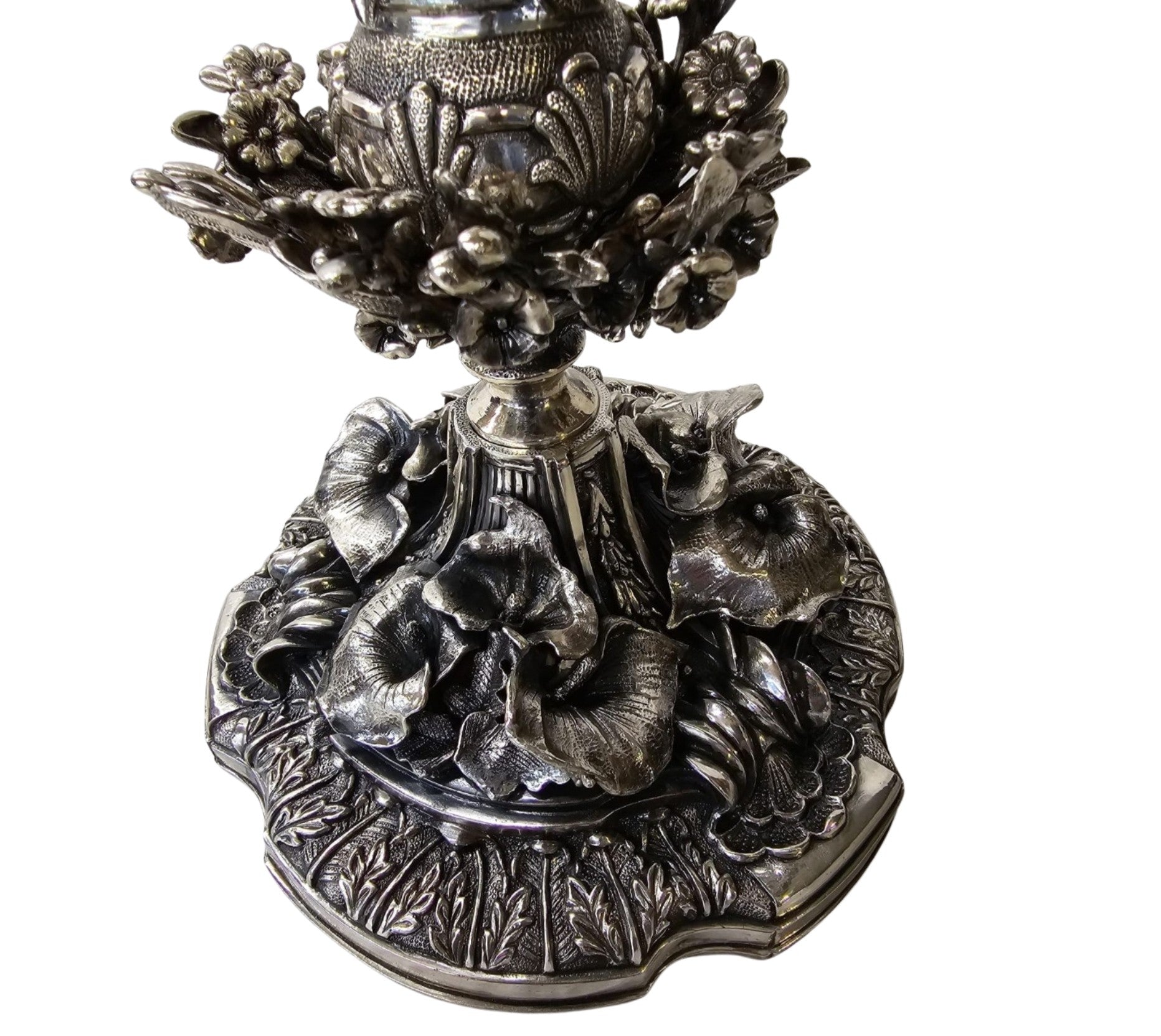 Sterling silver candelabra base detail with floral relief and sculptural ornamentation luxury centerpiece