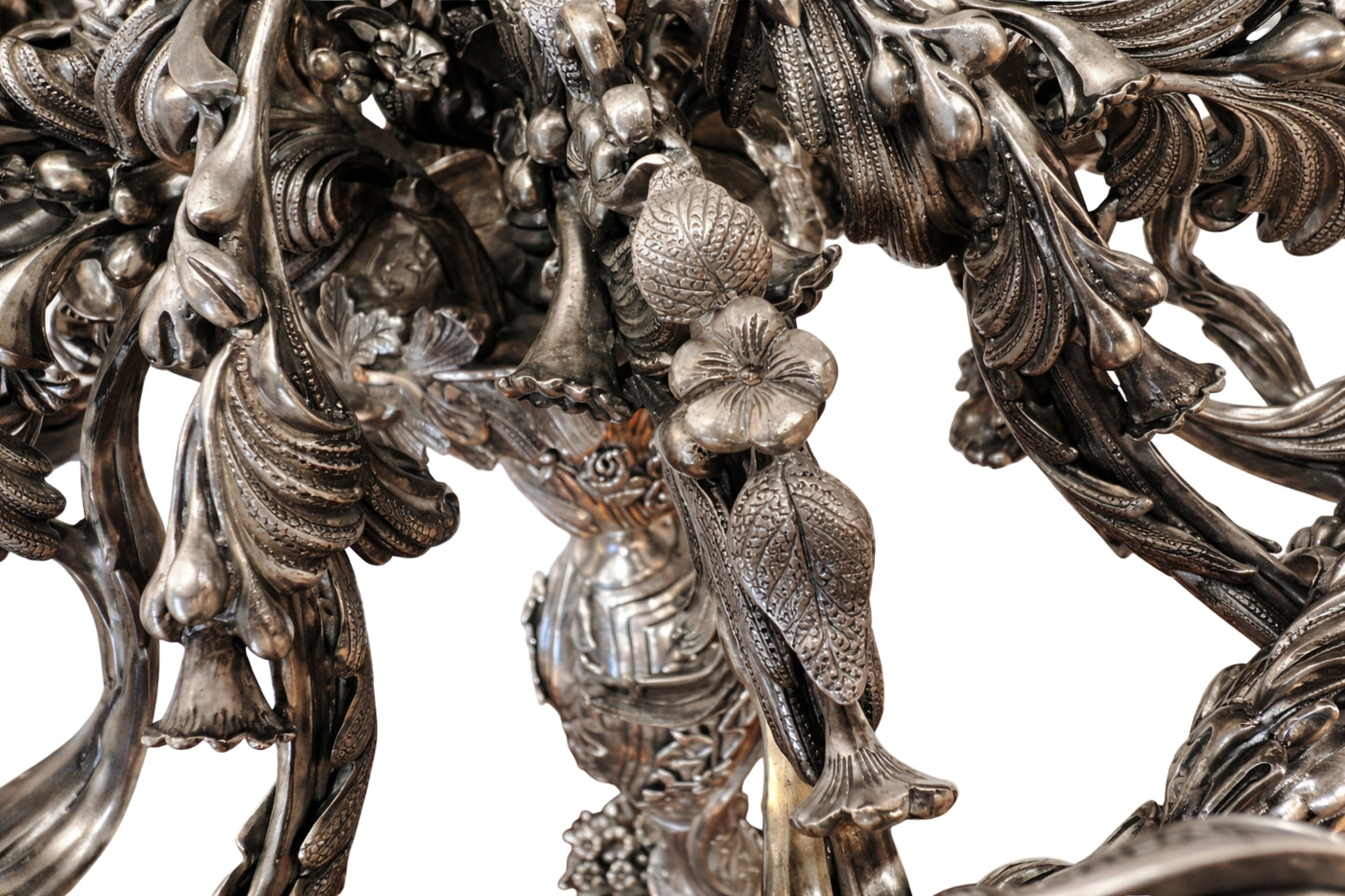 Hand chased sterling silver flower detail candelabra close up showing texture and engraving