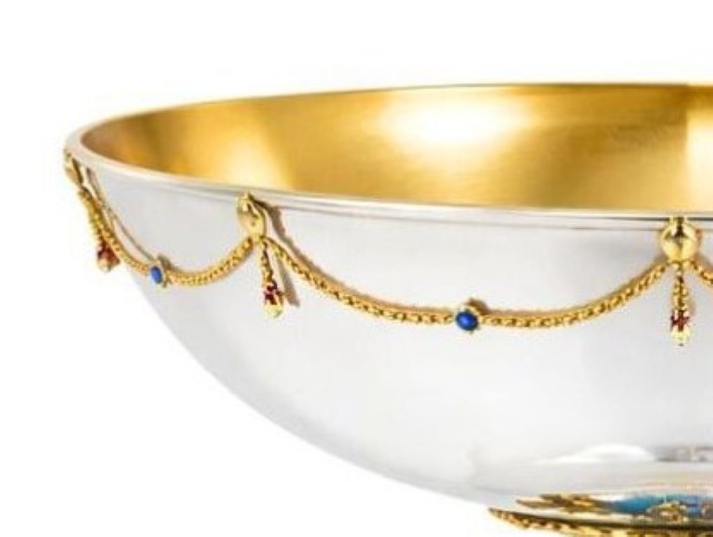 Sterling silver bowl rim with gold vermeil garland decoration and blue gemstone accents, luxury centerpiece detail