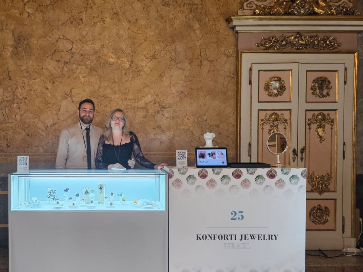 Konforti Jewelry founders Inga and Barak Konforti standing at their Milano Jewelry Week 2025 Jewelry Hub exhibition booth, showcasing the Stone Garden Collection of fine art rings.