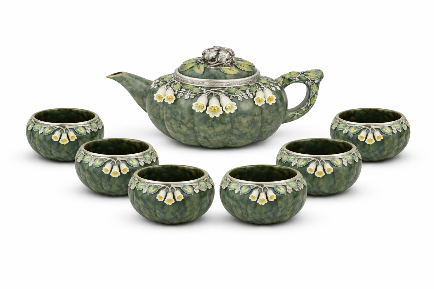 Luxury nephrite jade tea set including teapot and six cups, featuring hand carved white jade flowers, yellow sapphire centers, and detailed silver enamel foliage